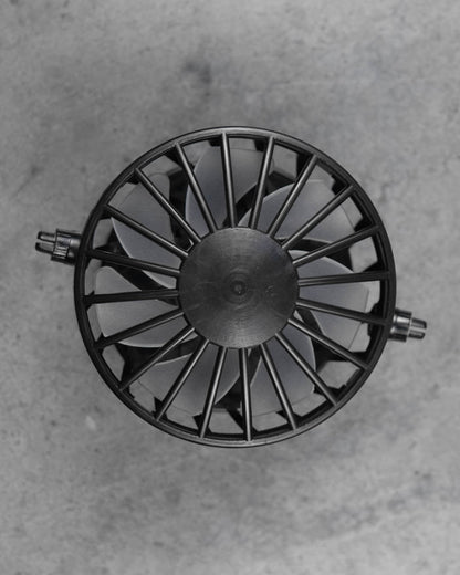Close-up of FannyCap replacement fan underside showing black cage design and fan blades